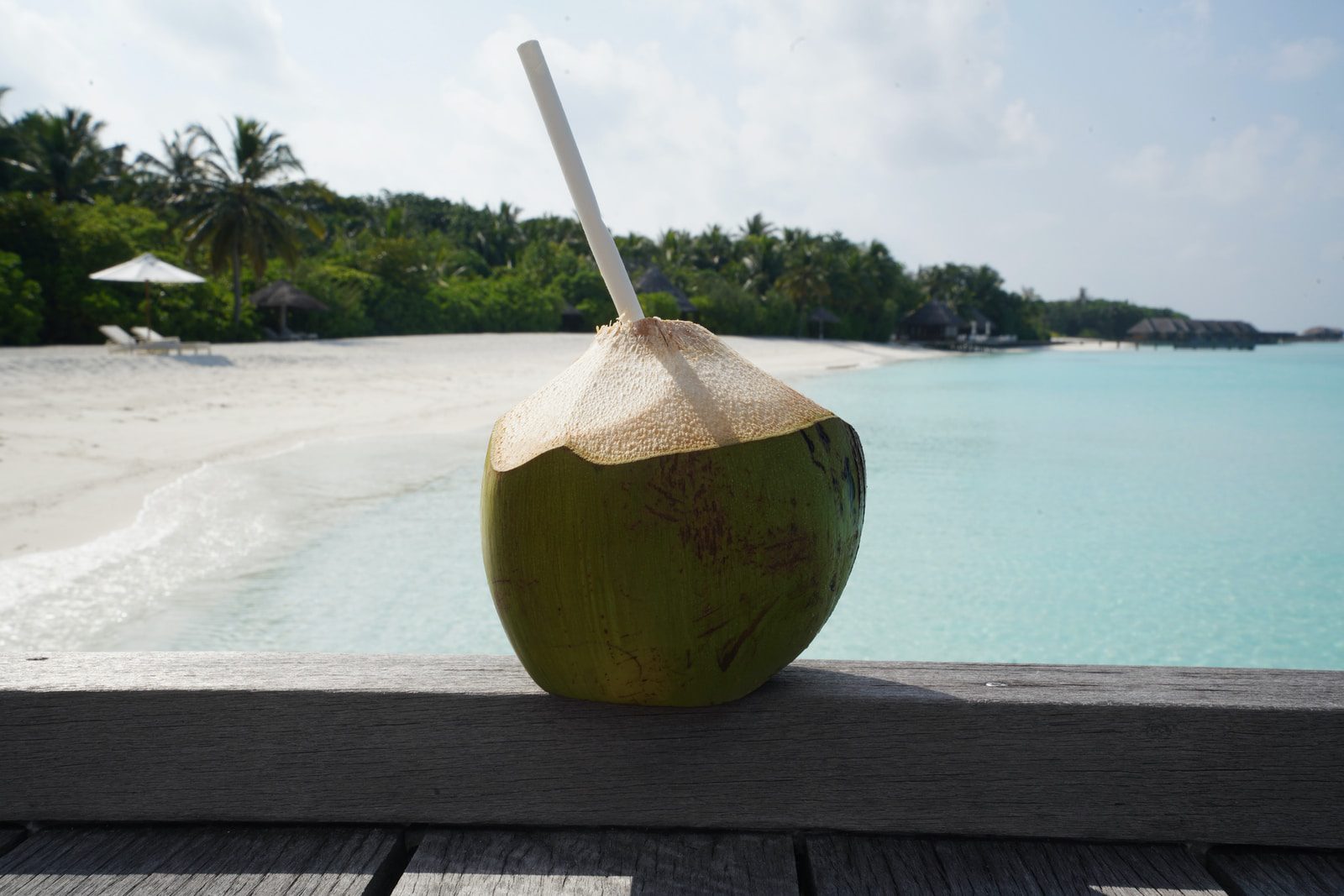 coconut fruit on brown wooden table